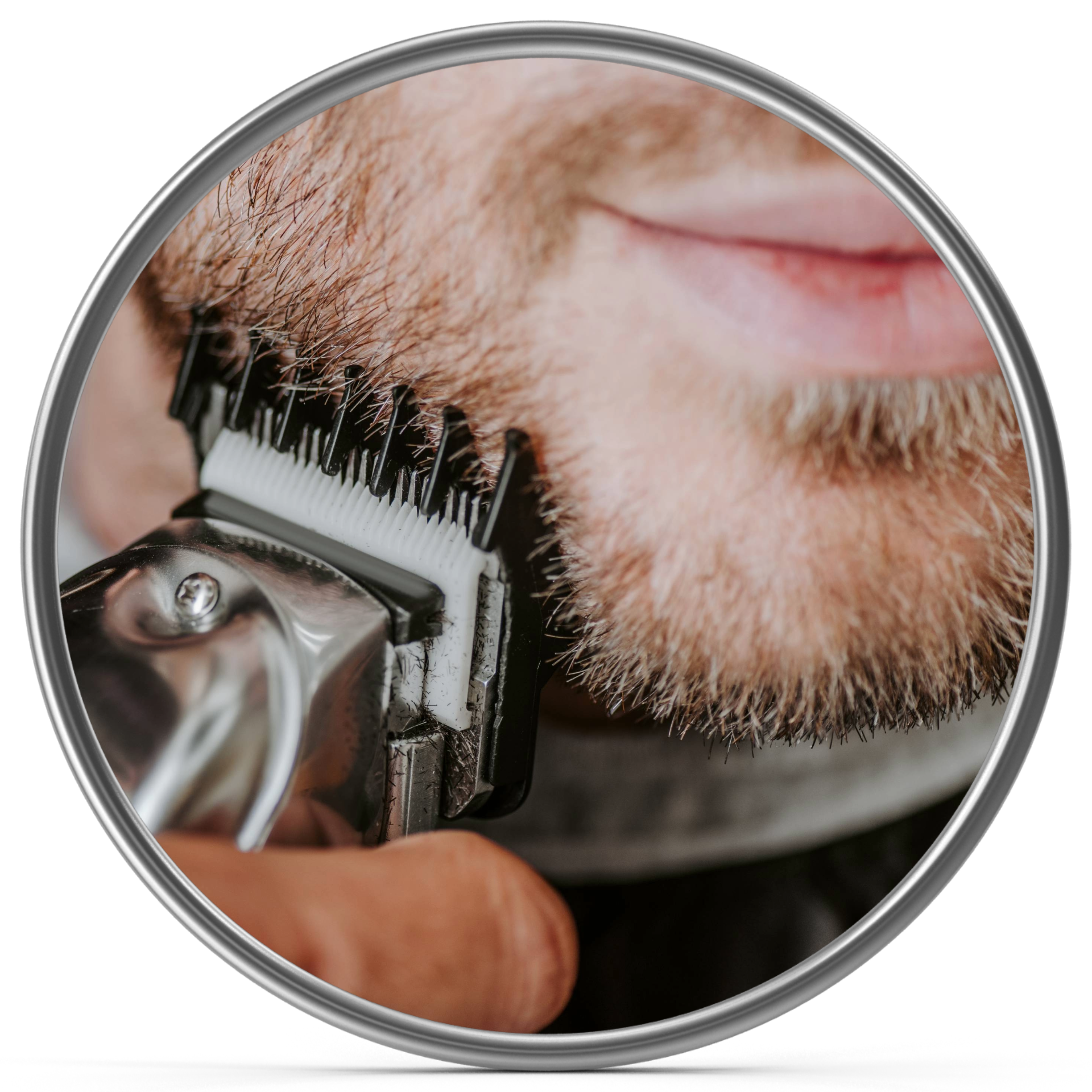 Close-up of a man with a beard getting a haircut with electric clippers.