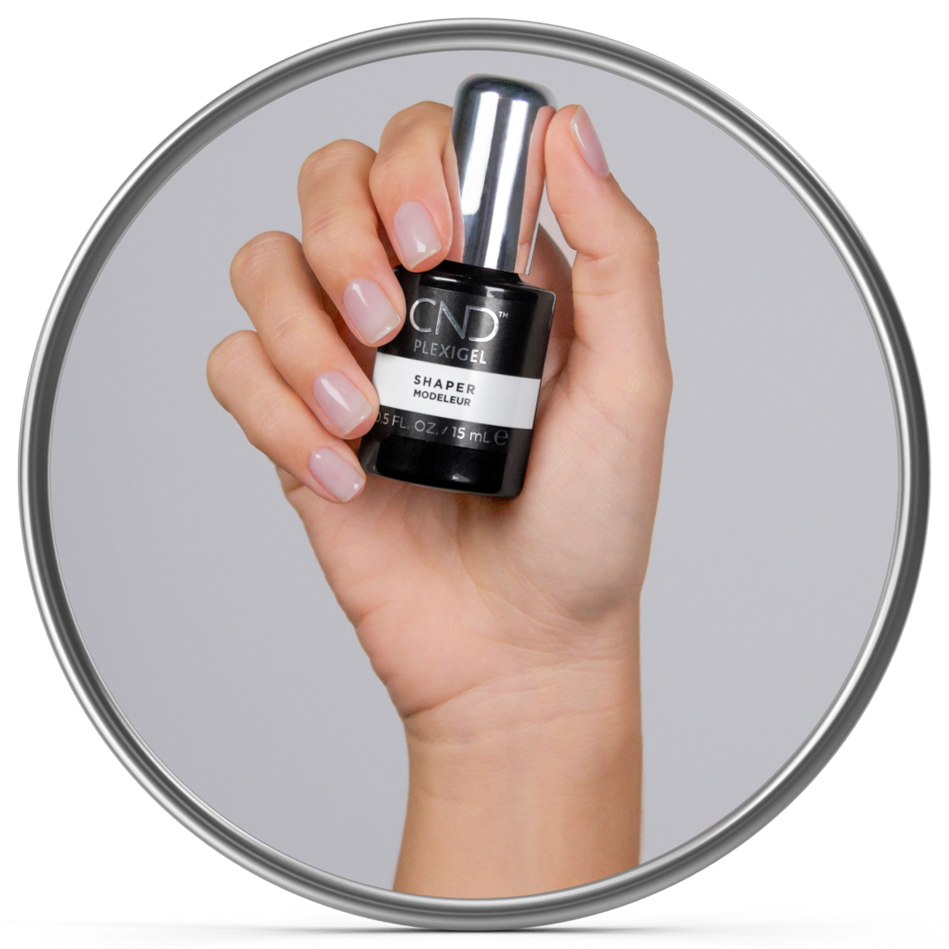 Hand holding a bottle of CND Plexigel Nail Shaper against a gray background.