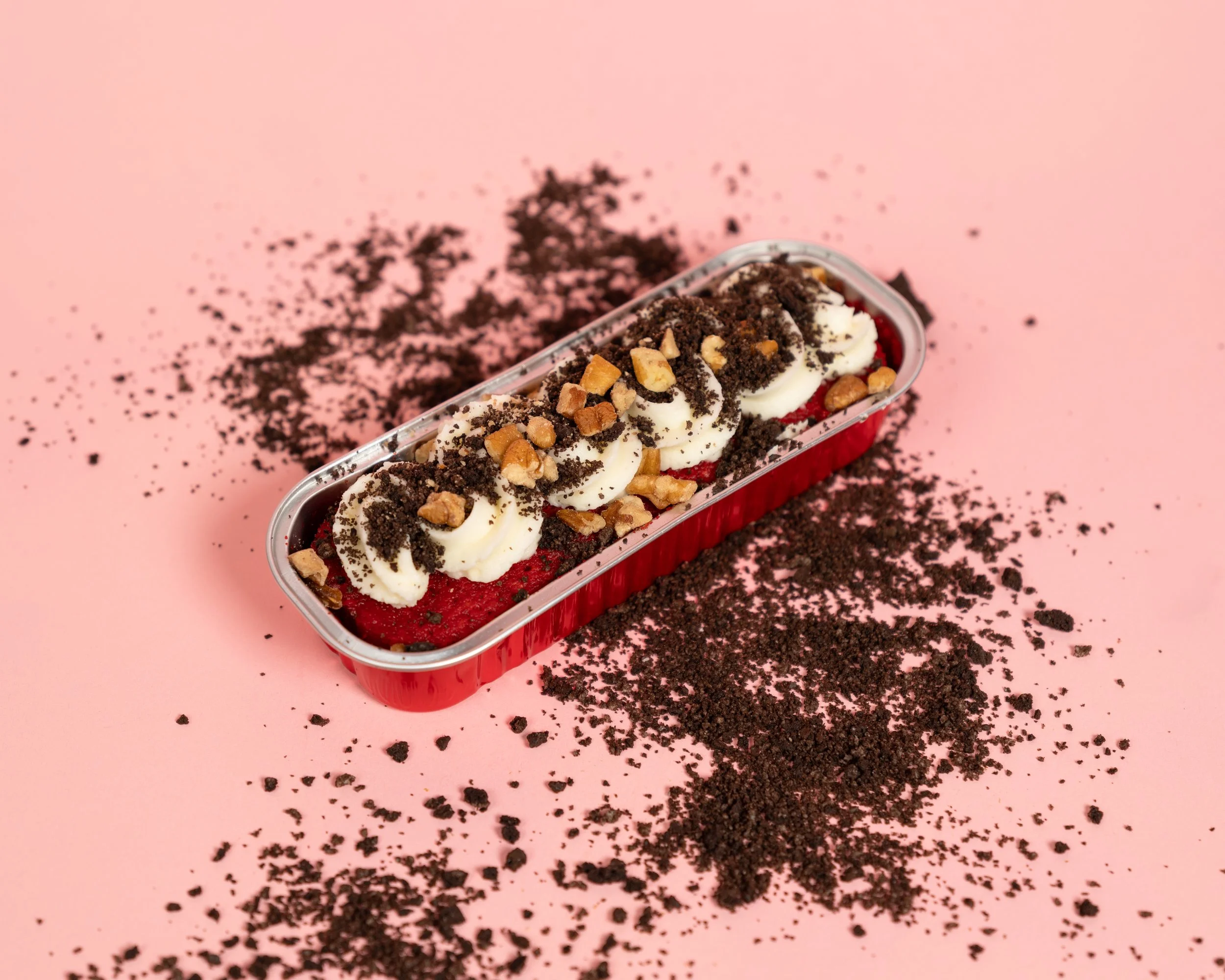 red velvet cake with pecan and oreo toppings