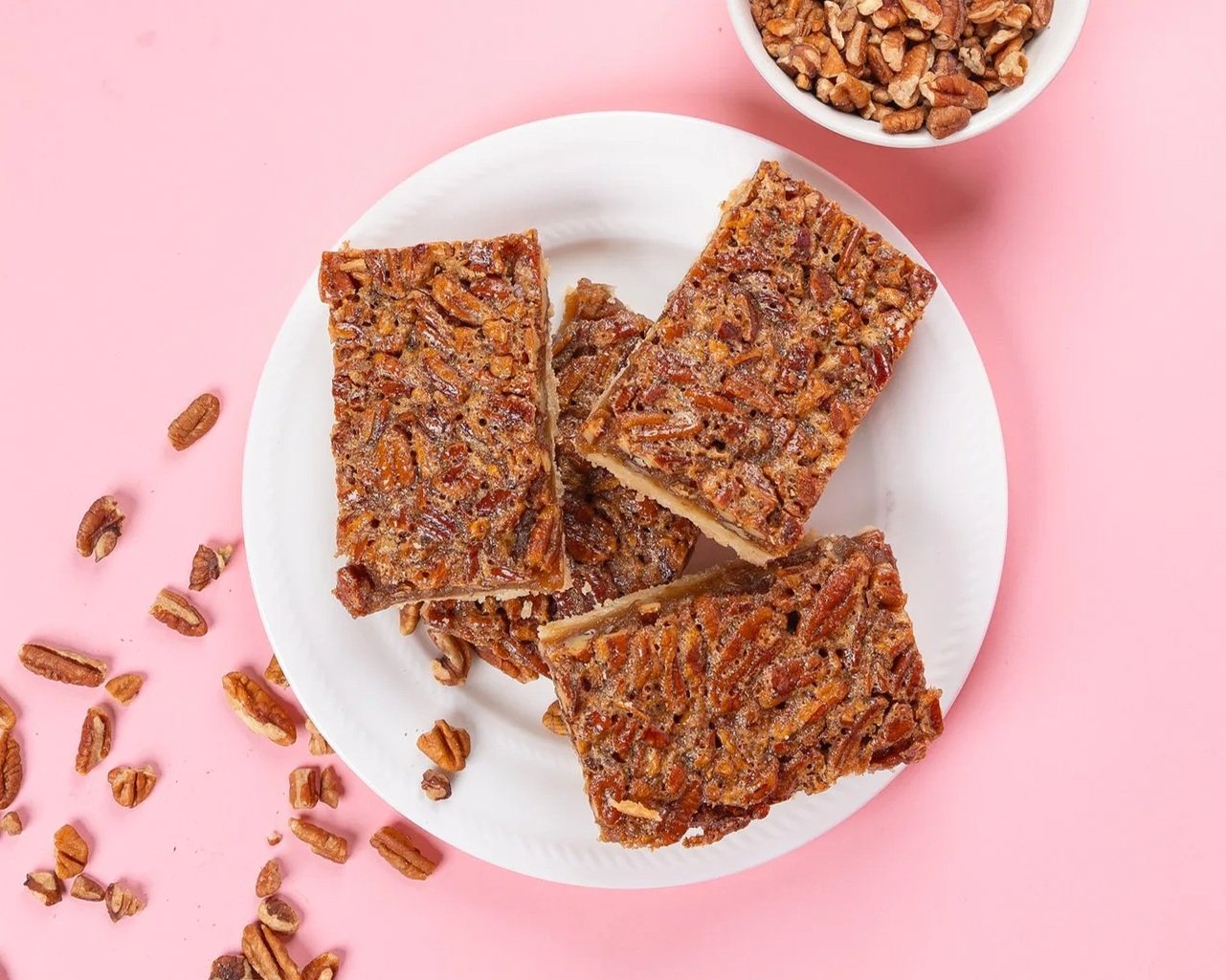 pecan pie bars on white plate