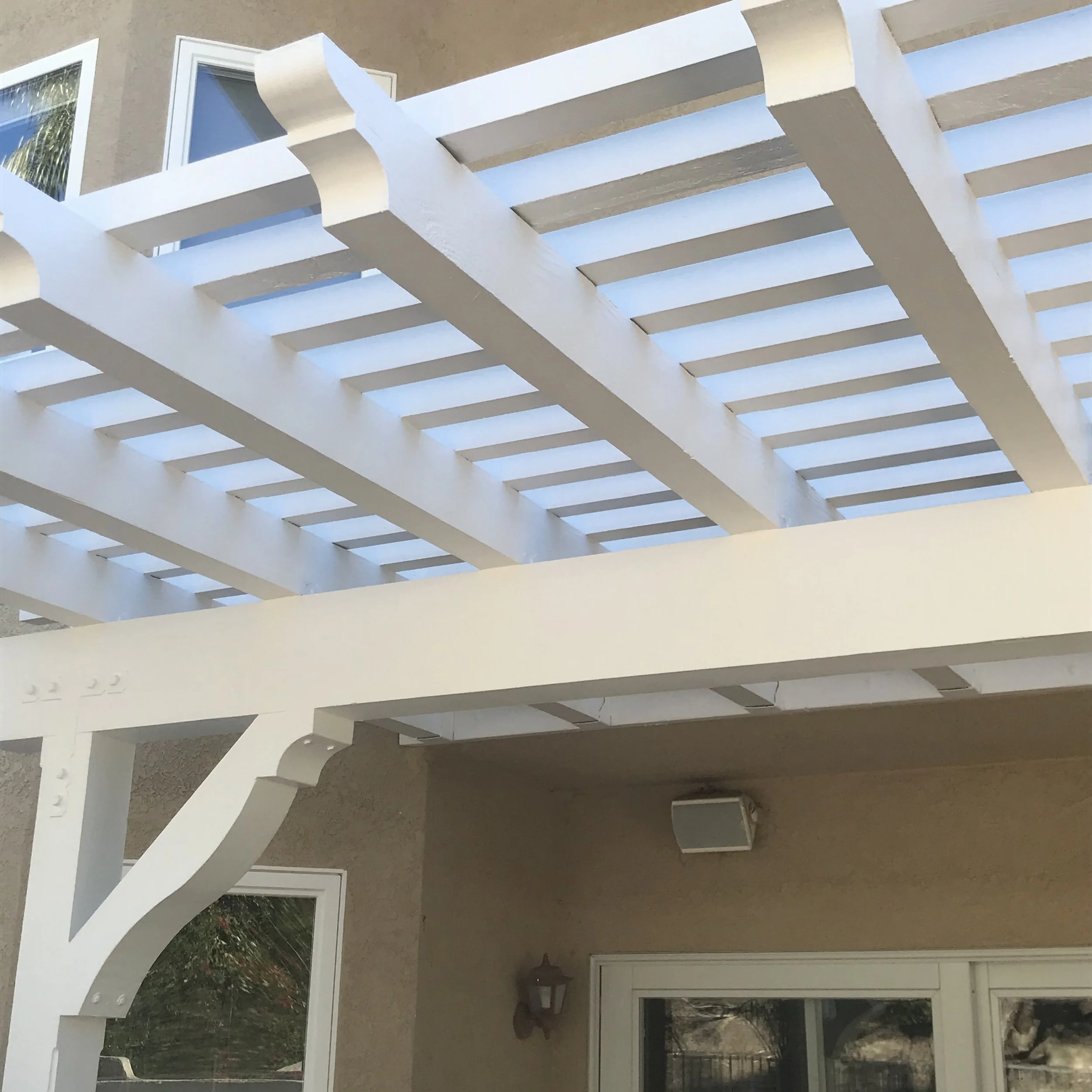 White patio cover painted by Garrett Dalton Inc