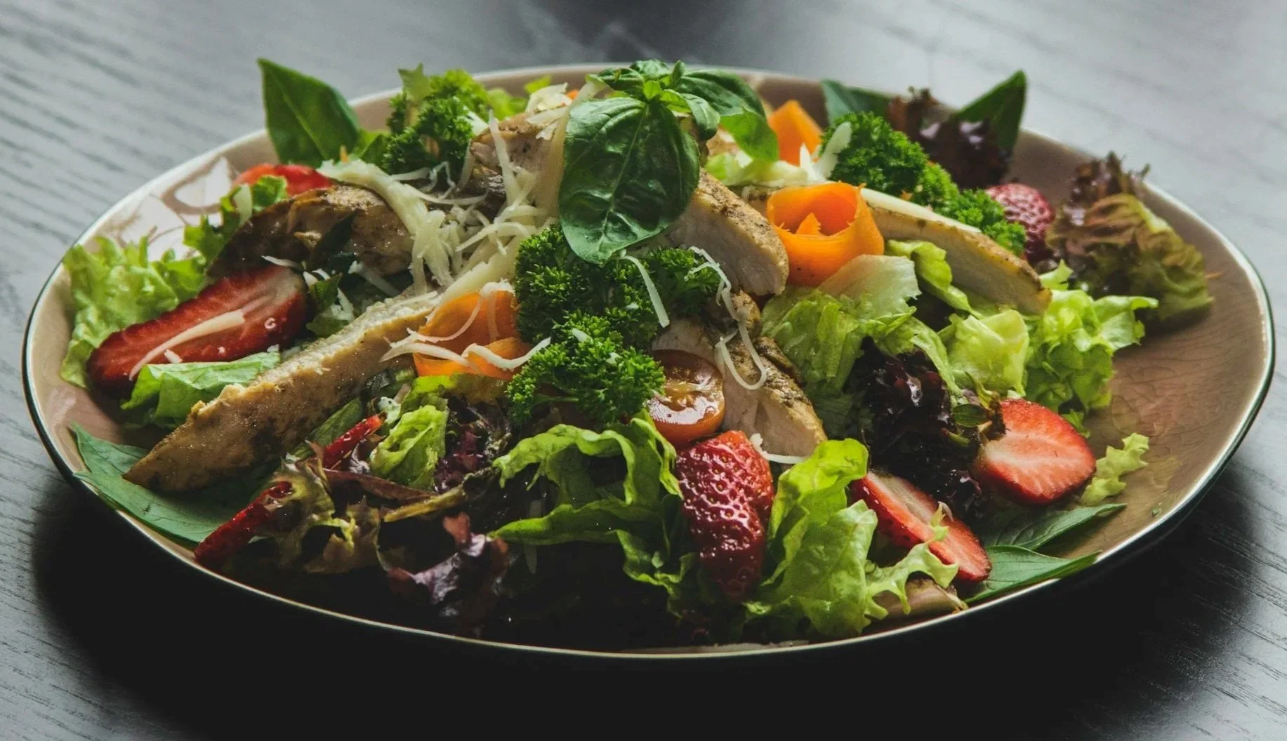 Chicken salad bowl made with whole foods, representing balanced, protein-rich meals.