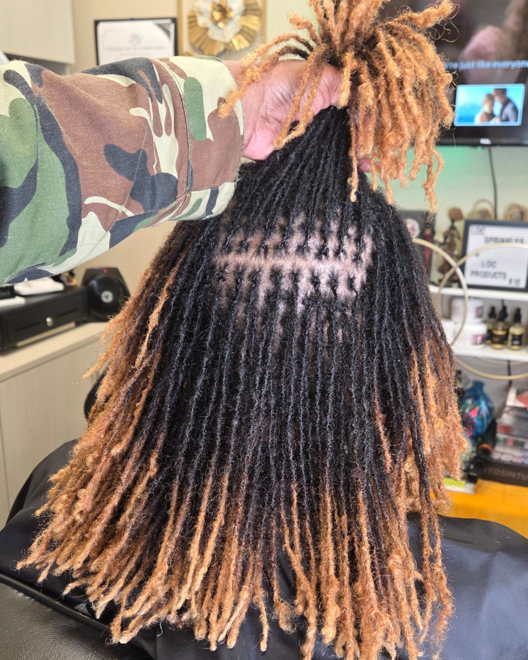mature color treated microlocs or Sisterlocks maintained by Shamate Reid Brown in Oakland, California