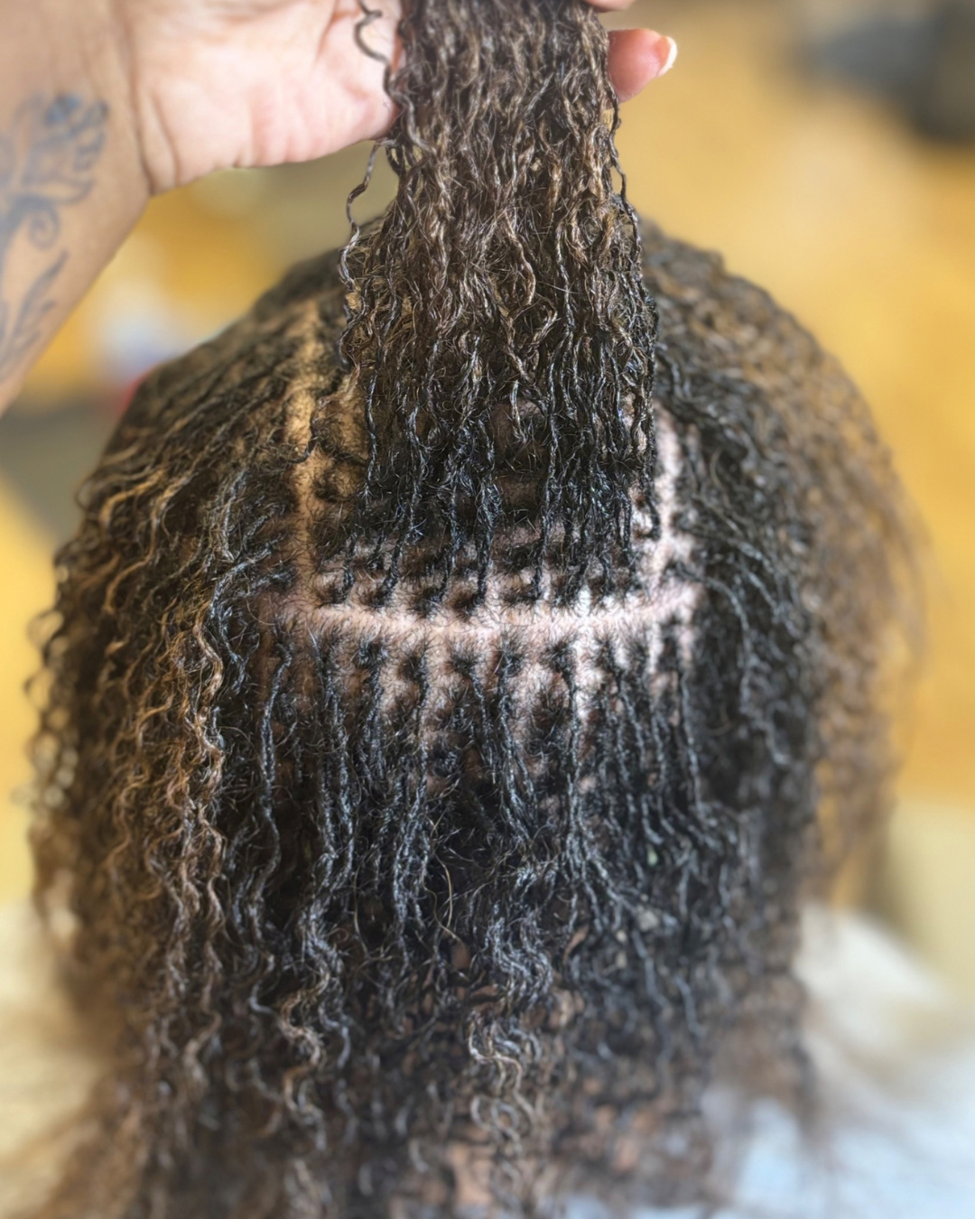 Interlocked microlocs and clean grid maintenance by Audelà Beauty in Stafford, VA