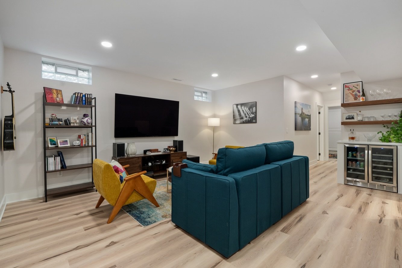Once a blank, unfinished space to today, a perfect space to hang out, play and host -- for book club or overnight guests. 

We loved creating a multi-use space for this family to enjoy. Complete with a dry bar, guest quarters, full bath and our favor