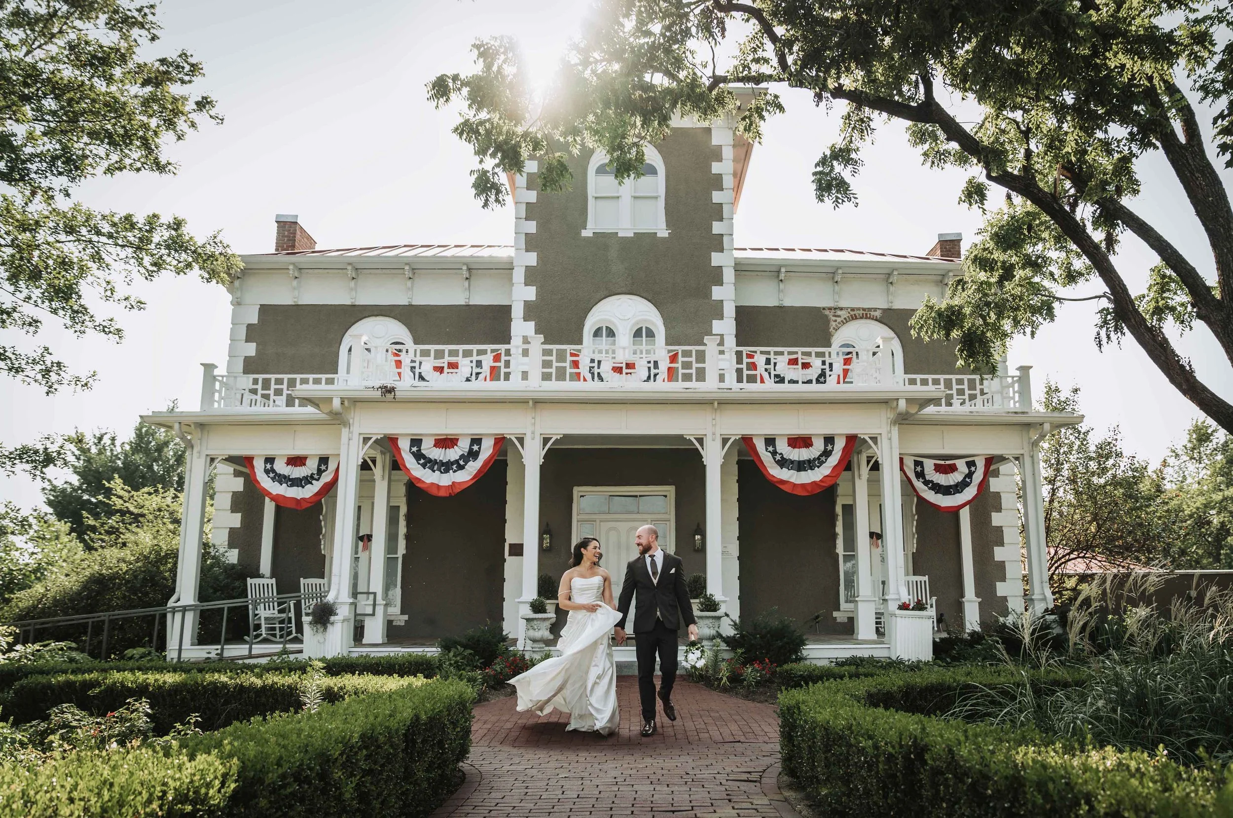 Bride and groom walking at Peel Museum & Botanical Garden in Bentonville Arkansas