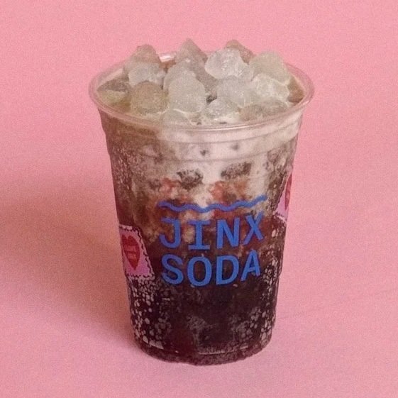 Dr Pepper based dirty soda with cream, raspberry puree and pebbled ice