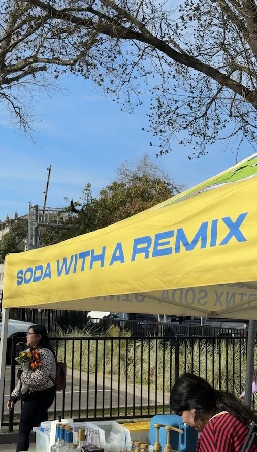 "Soda with a Remix" tagline on yellow canopy