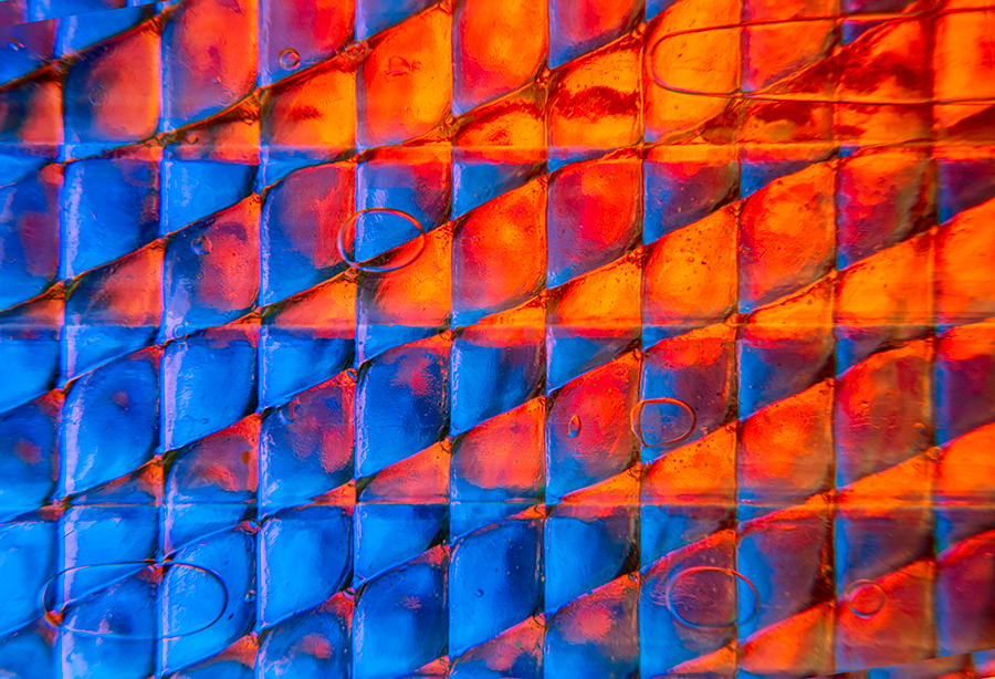 Abstract photograph "The Battle of Fire and Water" by Nahid Naderi, featuring a dynamic contrast of warm and cool colors, symbolizing the duality of existence.