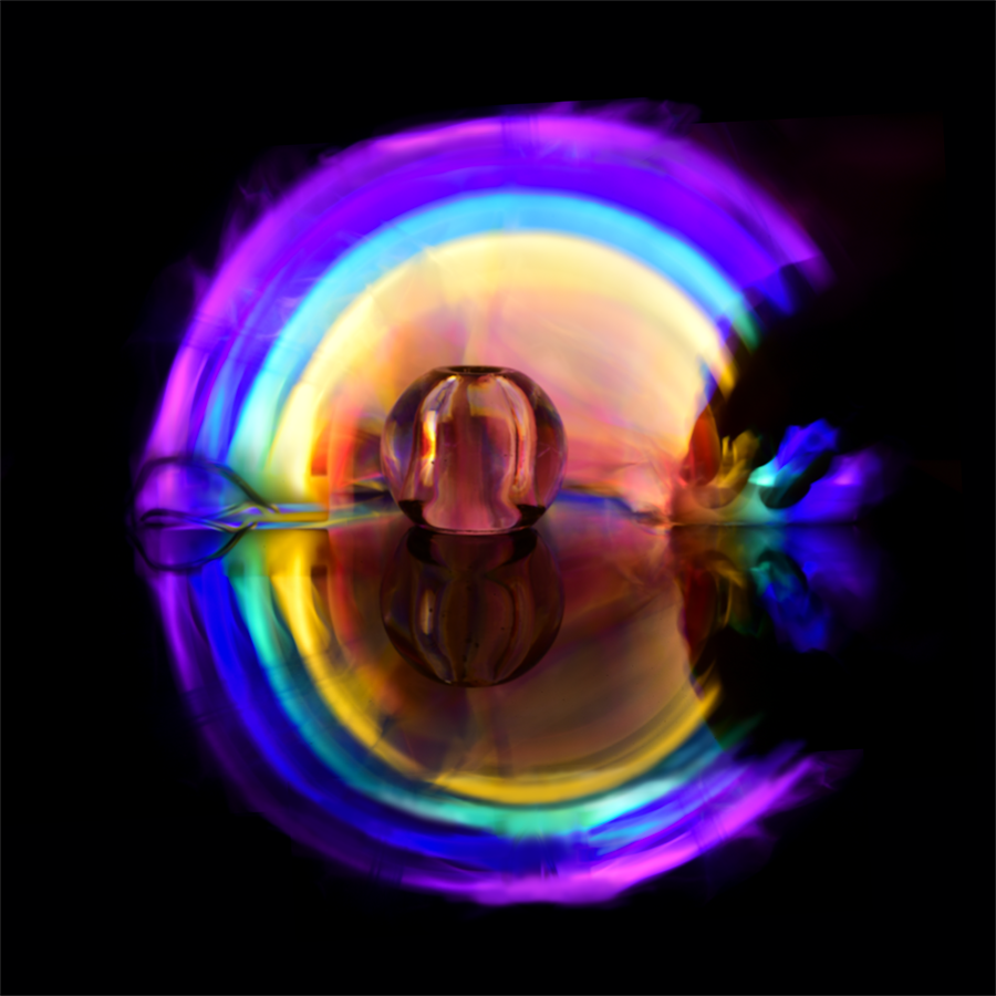 Abstract artwork depicting a fish emerging from layers of colored light in darkness, symbolizing the journey into the quiet, deep layers of the inner self and the emergence of authentic identity from within.