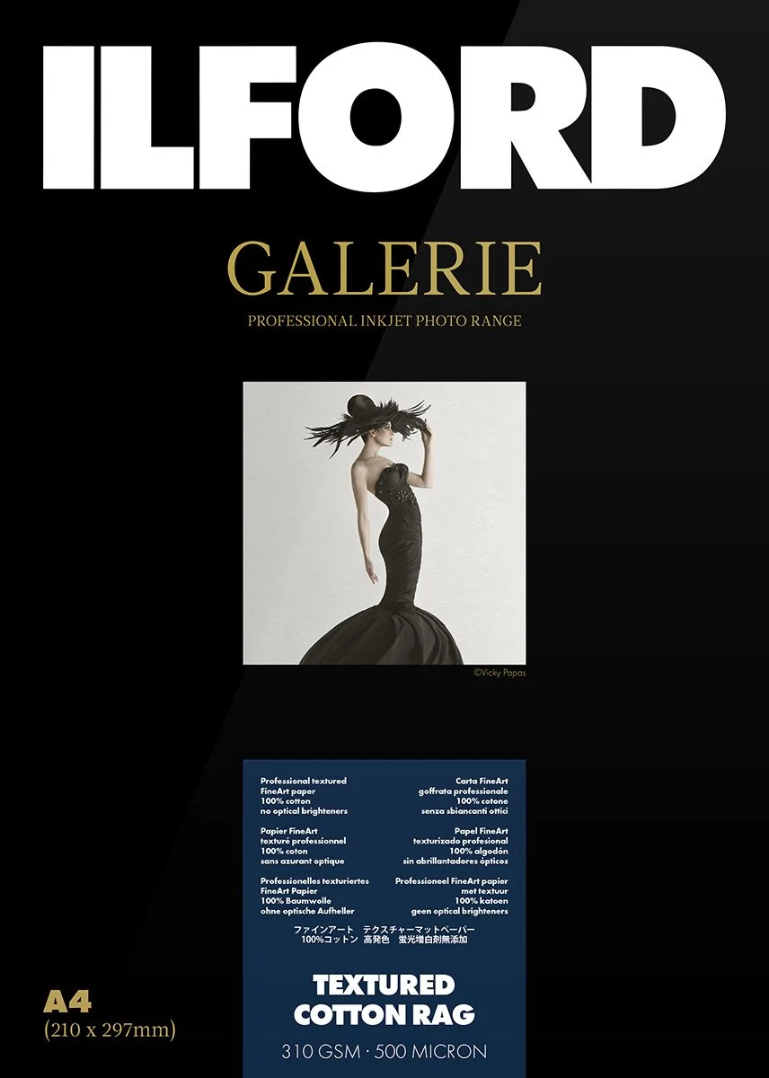 Ilford Galerie professional inkjet photo paper packaging, featuring an image of a model in a black dress, labeled "Textured Cotton Rag," with specifications 310 GSM, 500 Micron, and size A4 (210 x 297mm).