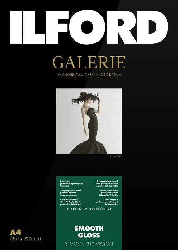 Ilford Galerie Smooth Gloss photo paper packaging featuring a fashion photo of a woman in a dark dress and hat, specifications for A4 size and 310 GSM thickness.