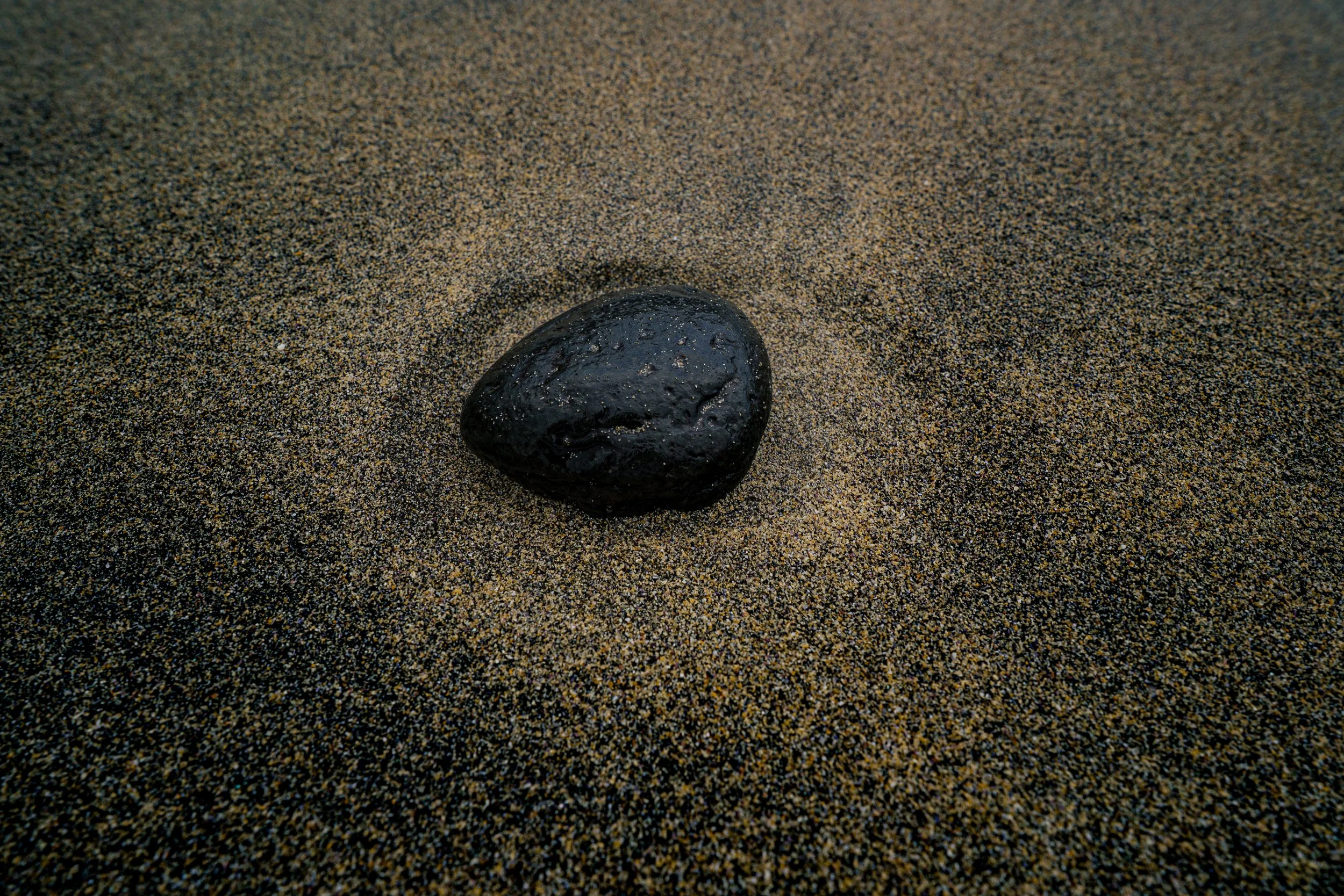 Beach rock smoothened by the waves in its nest. 