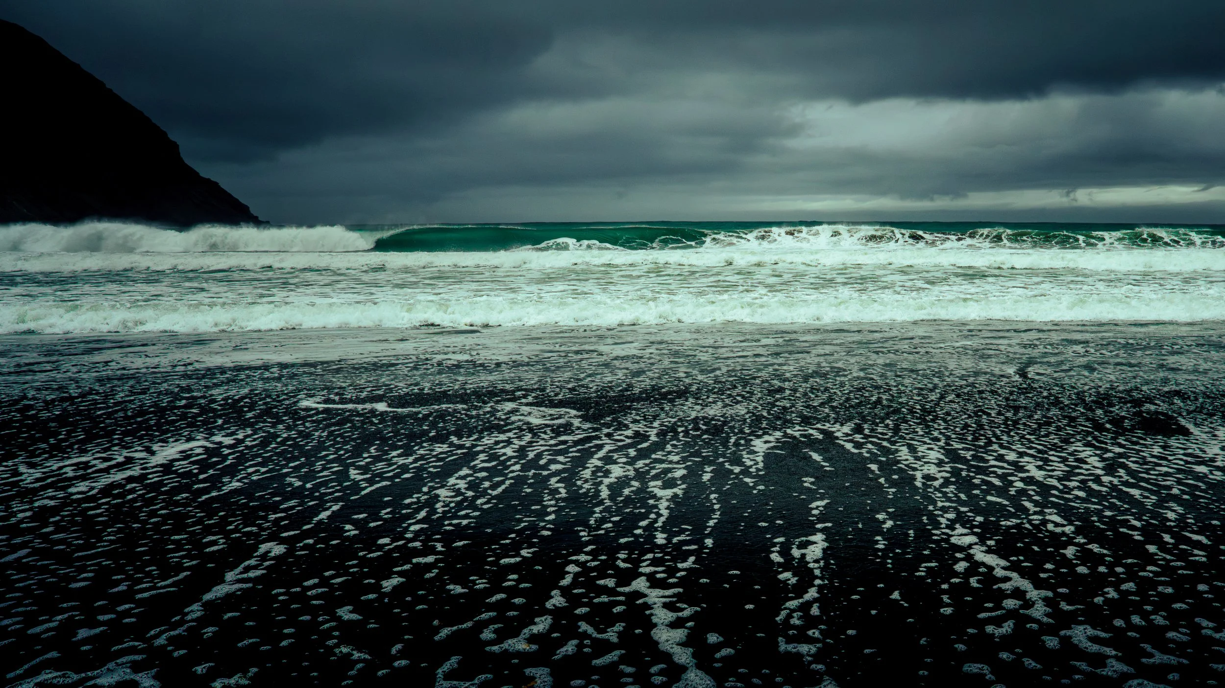 Iceland West Fjord black beach during a fall storm.