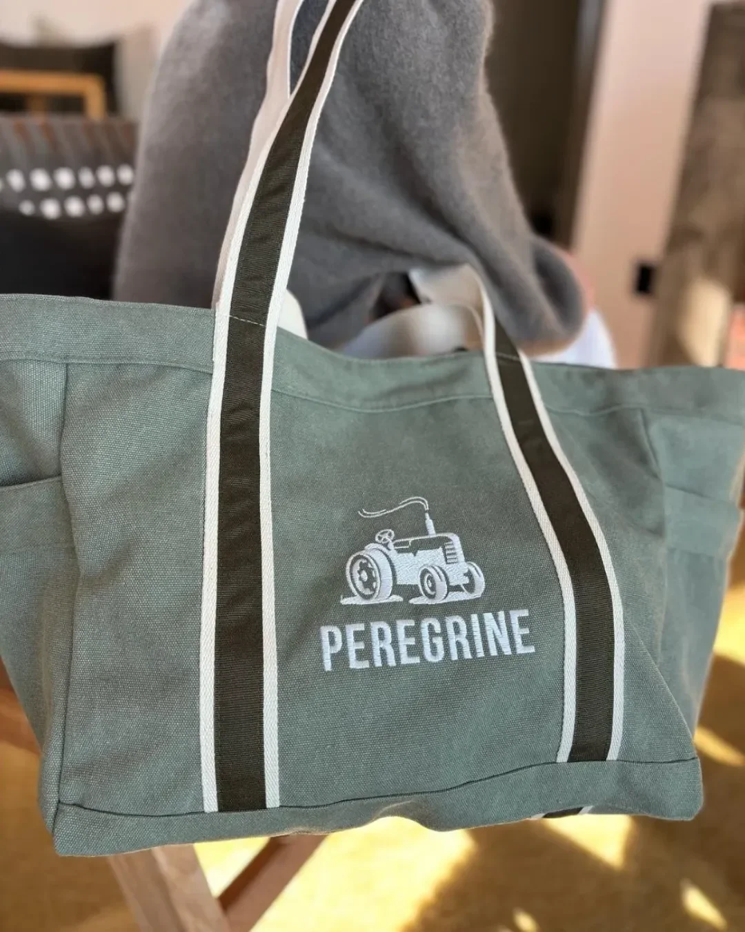 Branded olive green canvas tote bag with white and black handles and custom embroidery, Handmade by Soli in Cape Town for sustainable merchandise or corporate gifts.