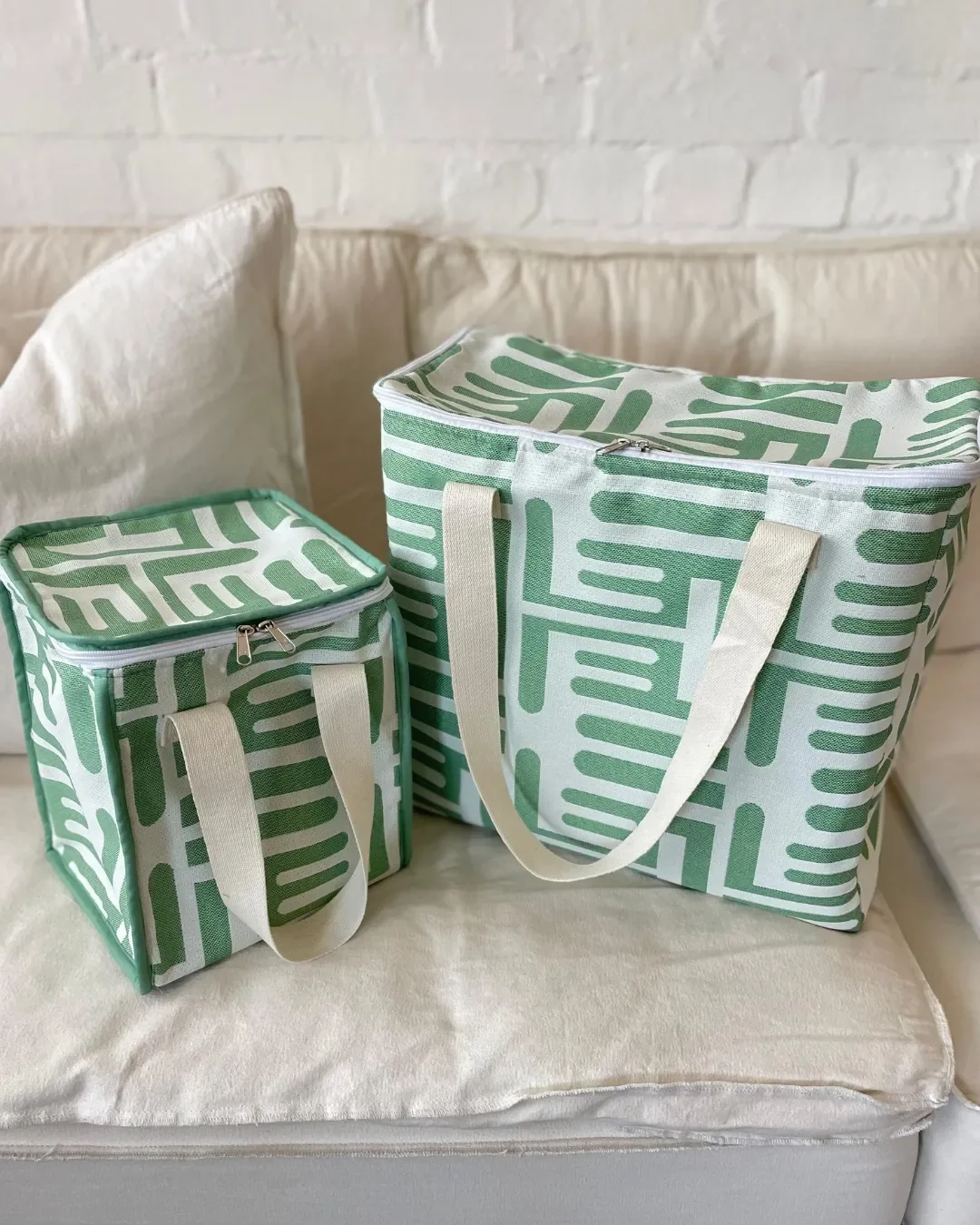 Large and small green patterned heavy canvas cooler bags with cotton handles. Handmade by Soli in Cape Town for sustainable merchandise or corporate gifts.