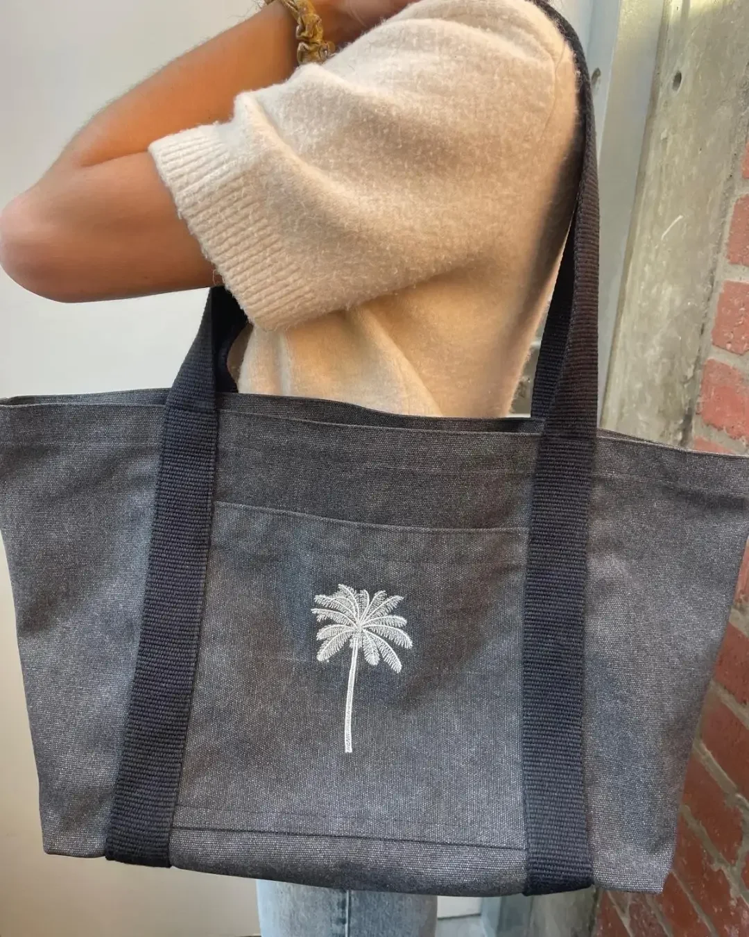 Branded Diesel bag in black canvas fabric with a tree embroidery for president hotel made by Soli in Cape Town