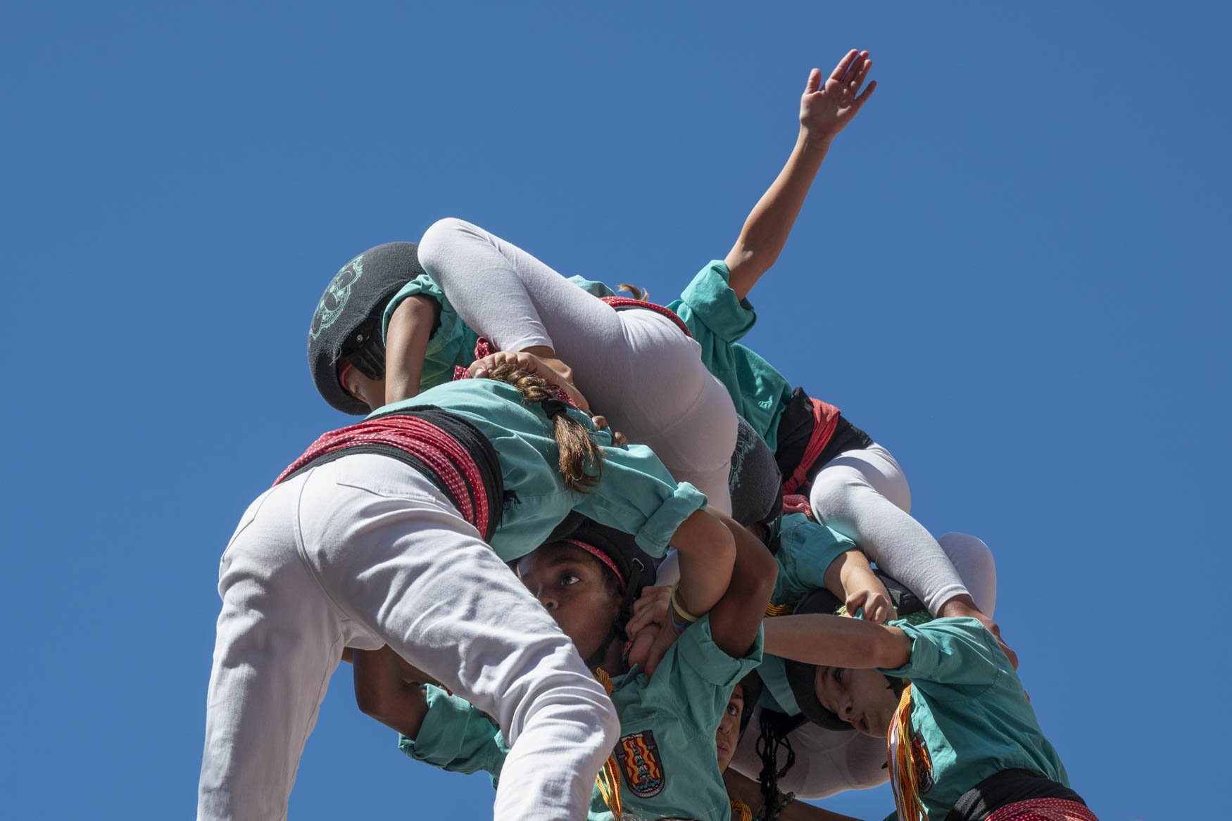 Kids on Top.
The Castells or Human Towers are a Catalan tradition dating back to the early 18th century and declared by UNESCO as Heritage of Humanity. The Castell is comprised of those who climb up the tower and the wide base there to support the we