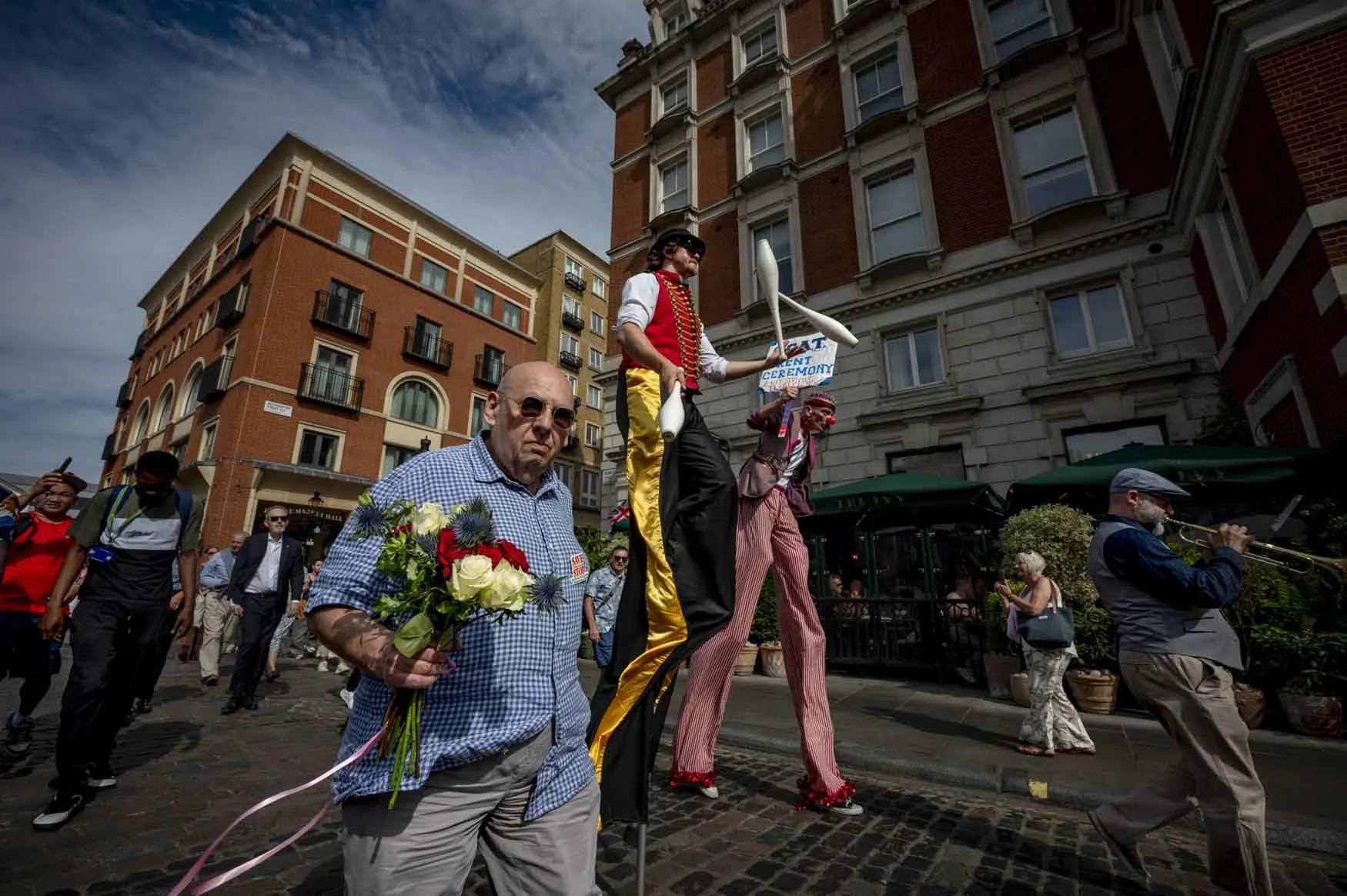 An Eccentric Parade.
The 2025 annual Rent Ceremony in Covent Garden. The ceremony is led by the town 
Crier, a band, entertainers, the trustees and the Lord Mayor who march in Covent Garden declaring a peppercorn rent. The peppercorn rent of five red
