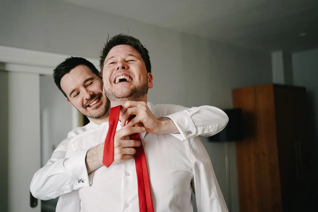 Fastening the best mans tie