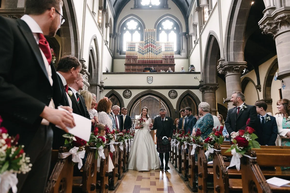 The bride walking down the aisle of St Wilfrids Church York