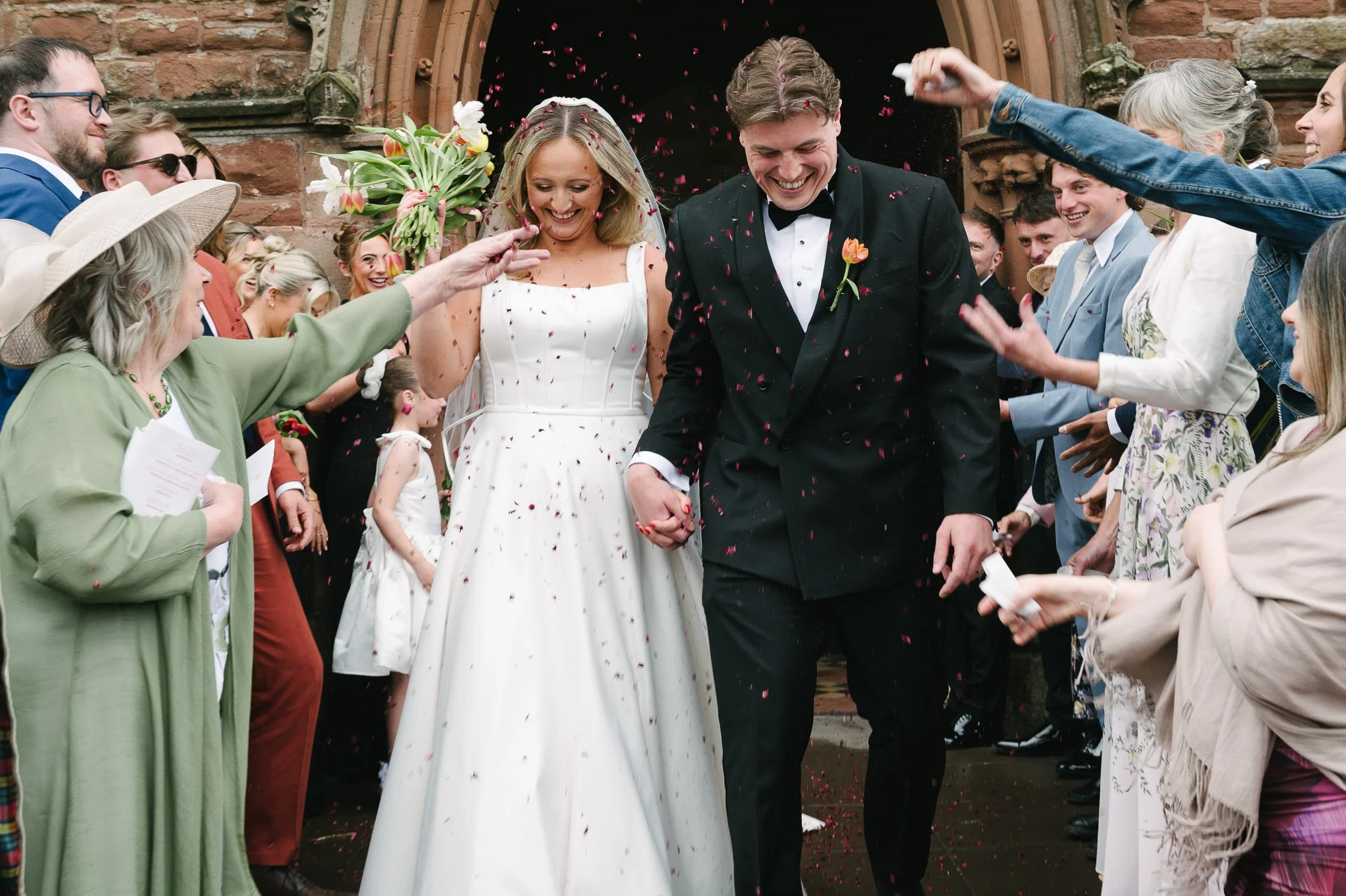 Leaving Peel Cathedral to guests throwing confetti