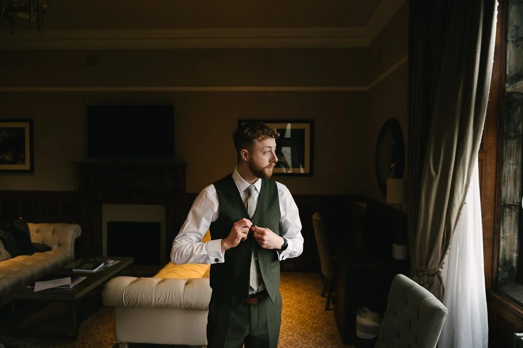 Best man looking out of the window Yorkshire Wedding photographer