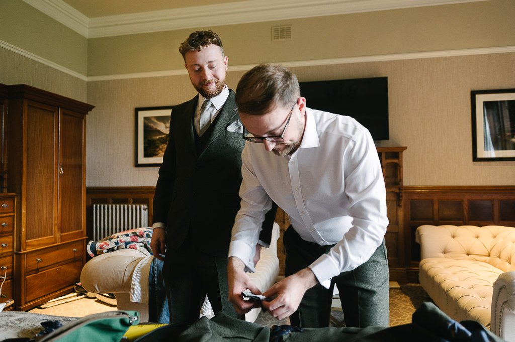 The groom and best man getting ready