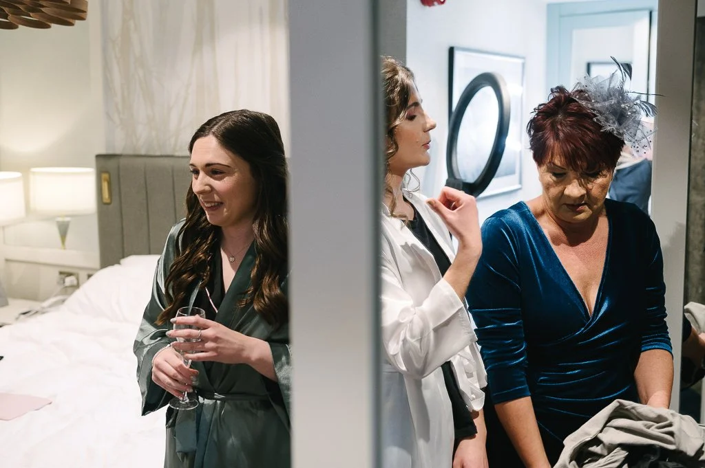Bride, her sister and their mum documentary wedding photographer