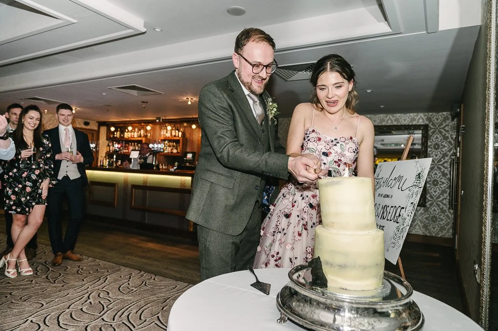 Cutting the cake by Mark Hillyer Skipton Wedding Photography