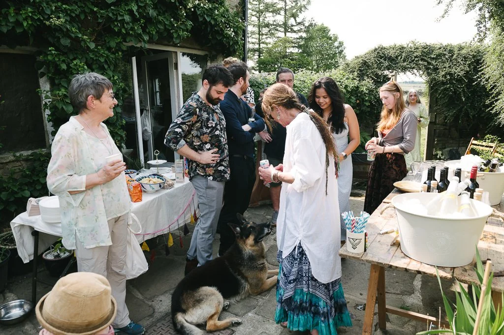 Wedding guests congregating and enjoying the relaxed atmosphere