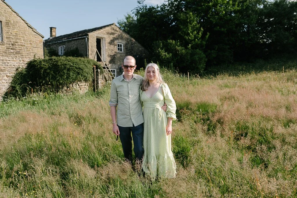 The Bride and groom with their North Yorkshire wedding venue behind them