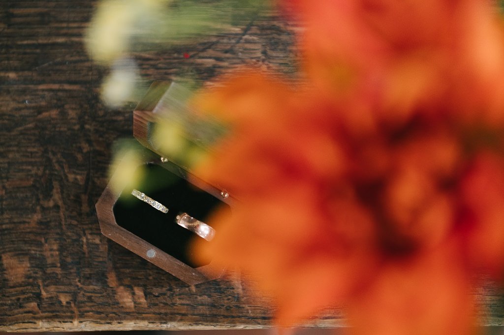 The wedding rings under some flowers on the altar at Left Bank in Leeds