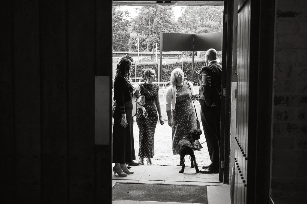 Ben greeting guests at the door