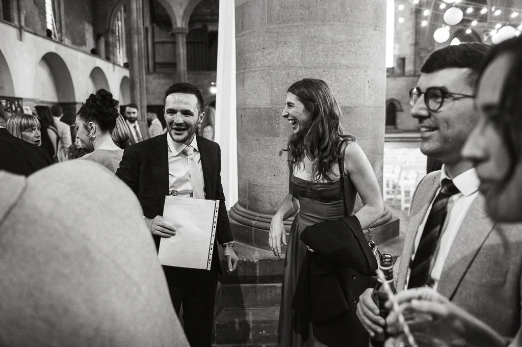 Guests laughing at the wedding ceremony
