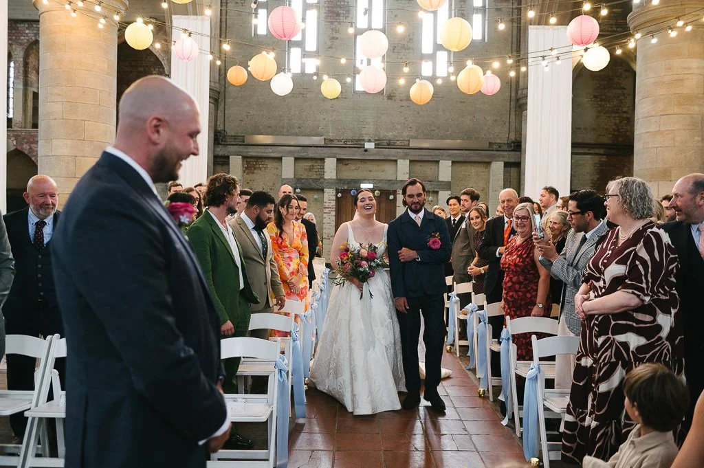 The Bride Arrives and walks down the aisle