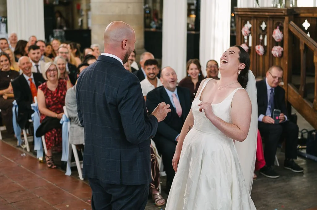 Ruby laughing at the wedding ceremony
