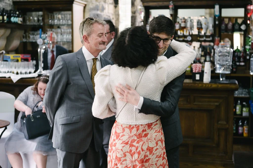 Groom greeting the guests