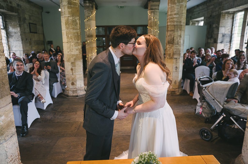 Bride and groom first kiss
