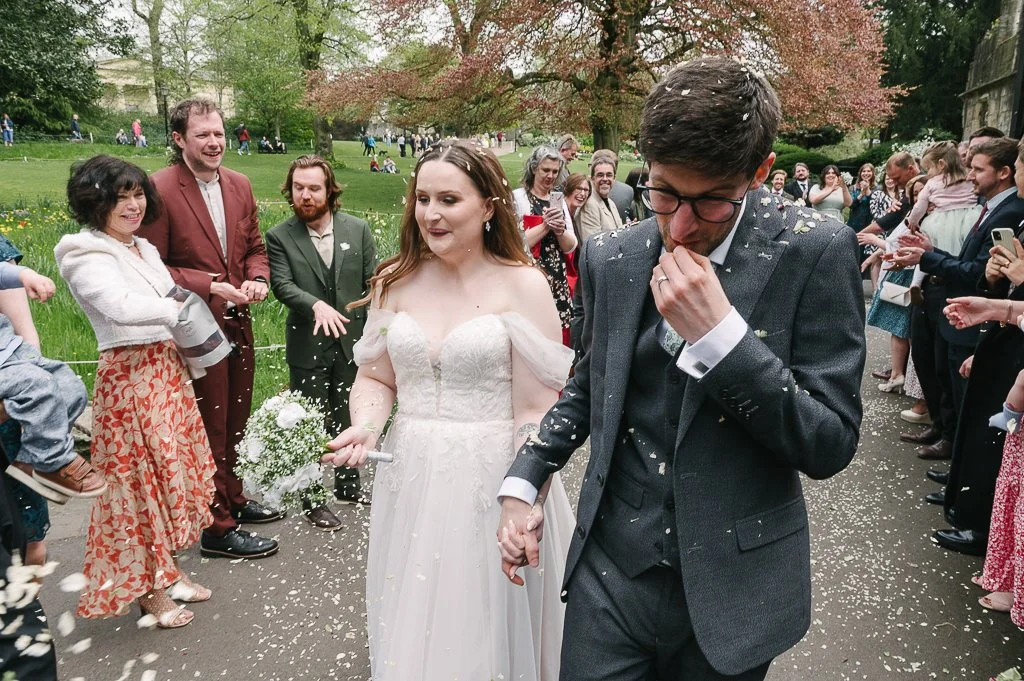York Wedding groom spitting out confetti