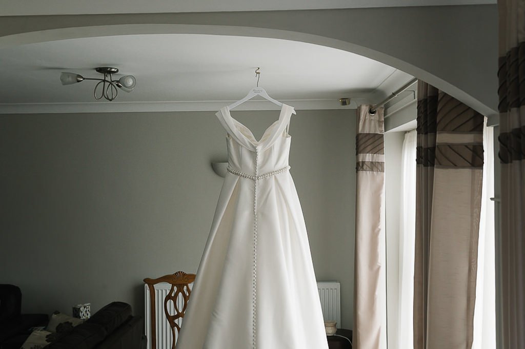 The back of Bella's wedding dress hanging up at home