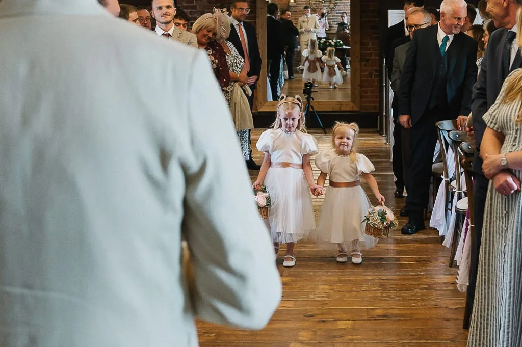 Flower girls arriving at the ceremony at Swancar Farm