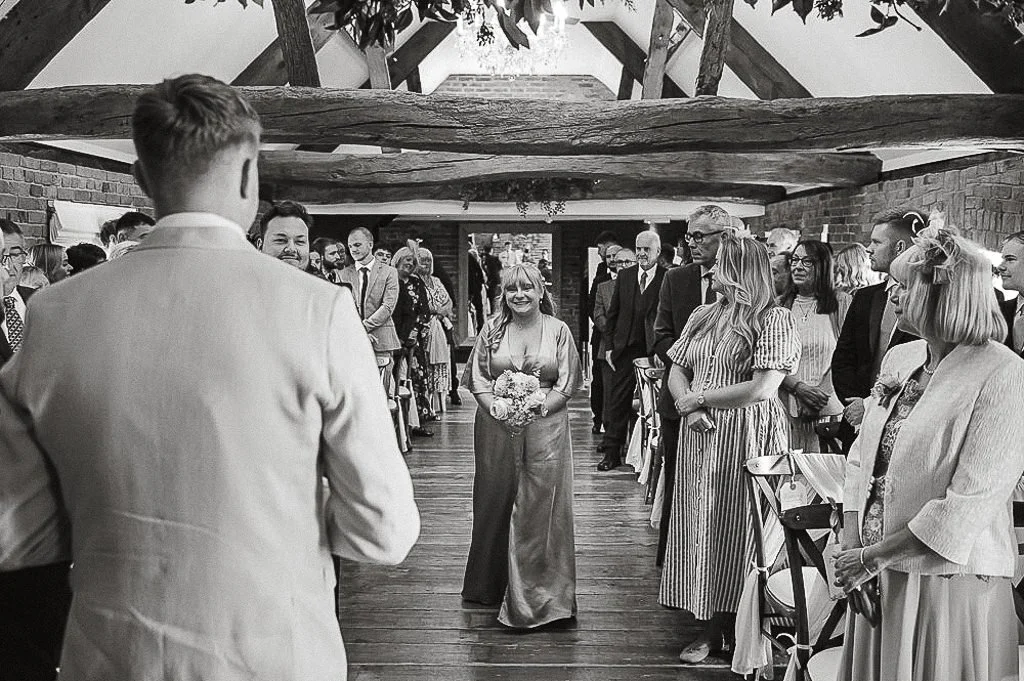 Bridesmaid walking down the aisle