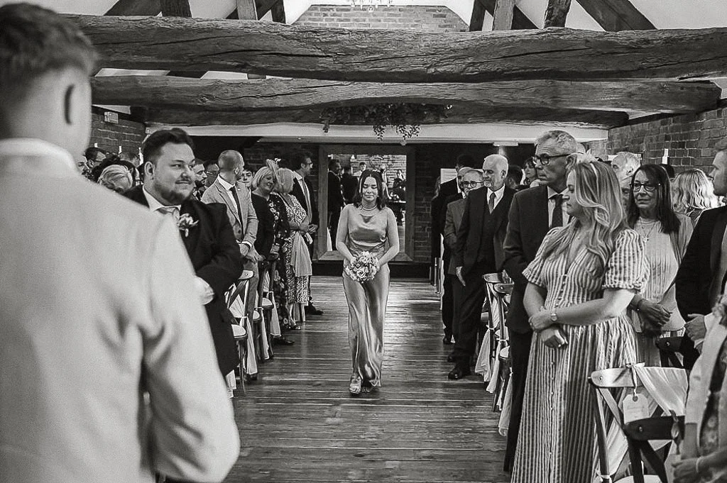 Bridesmaid walking down the aisle