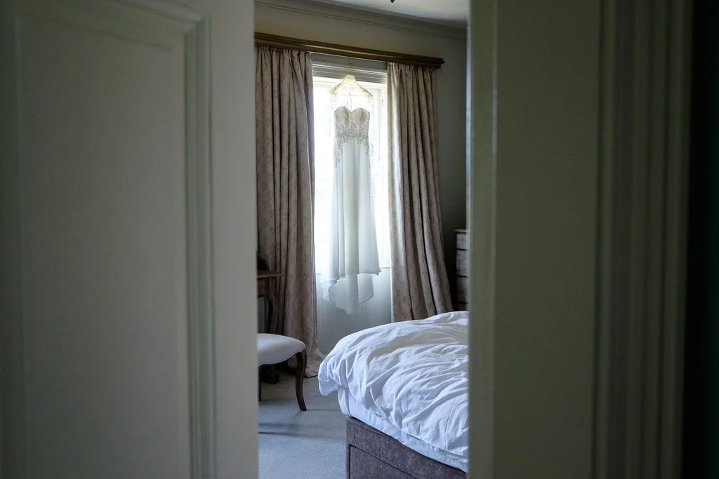 Wedding dress through the doorway