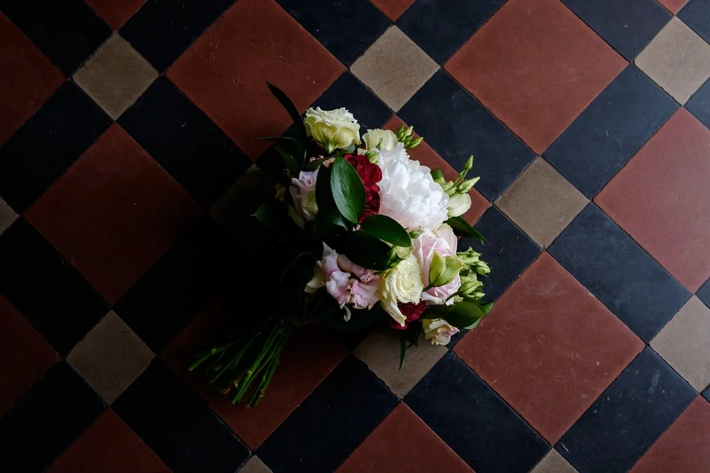 Bridal bouquet on the tiled floor of Hornington Manor