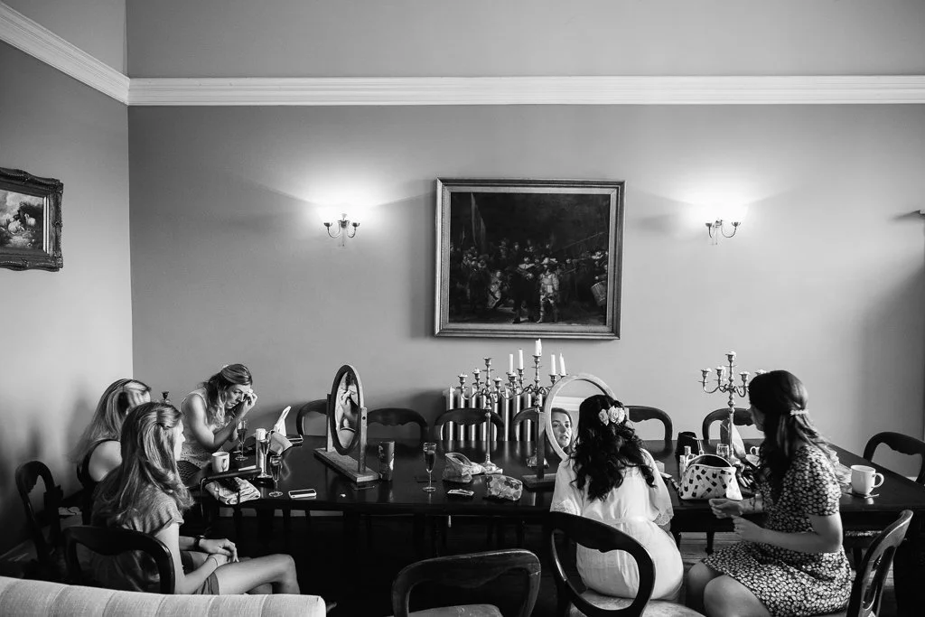 All the bridesmaids doing their makeup