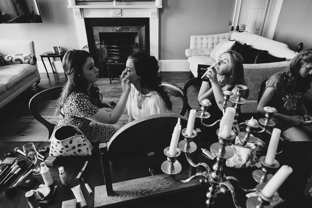 All the bridesmaids doing their makeup