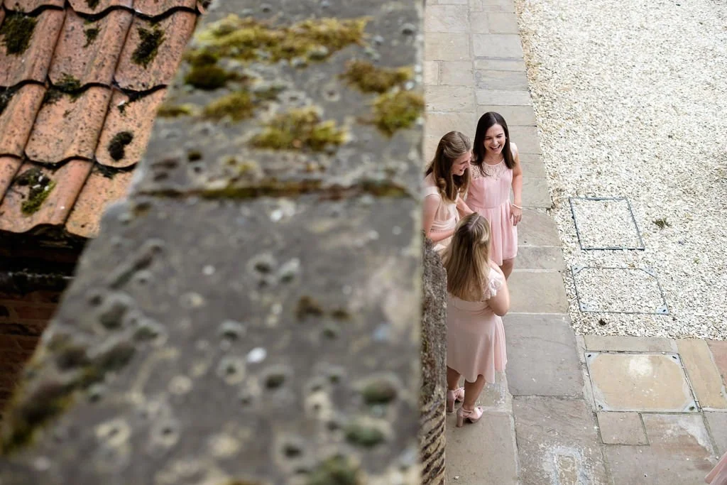 View of the bridesmaids from the upstairs window