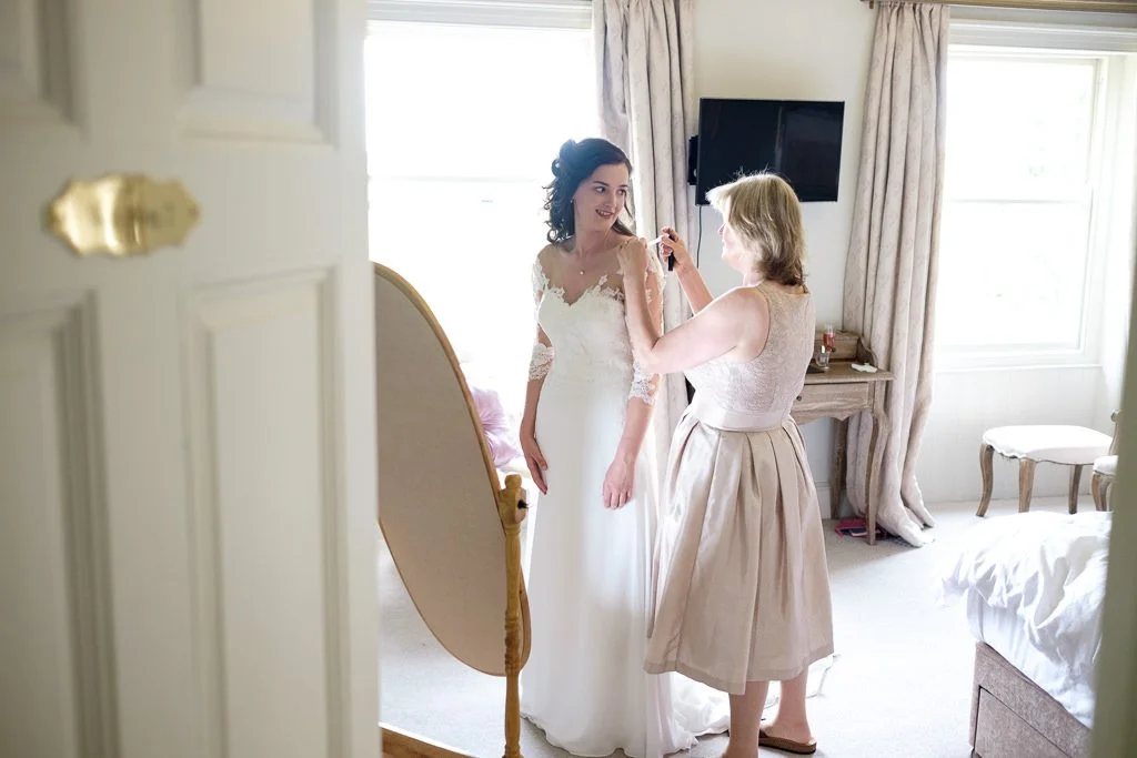 Putting on the wedding dress